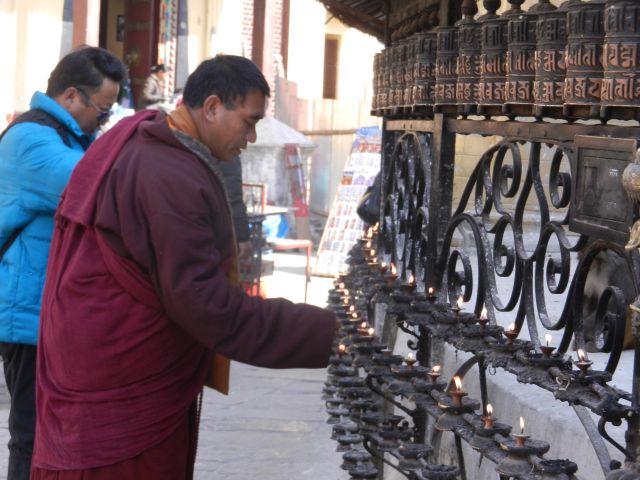 19.Buddhist_munk_with_prayer_wheels_Stupa 19.Buddhist_munk_with_prayer_wheels_Stupa