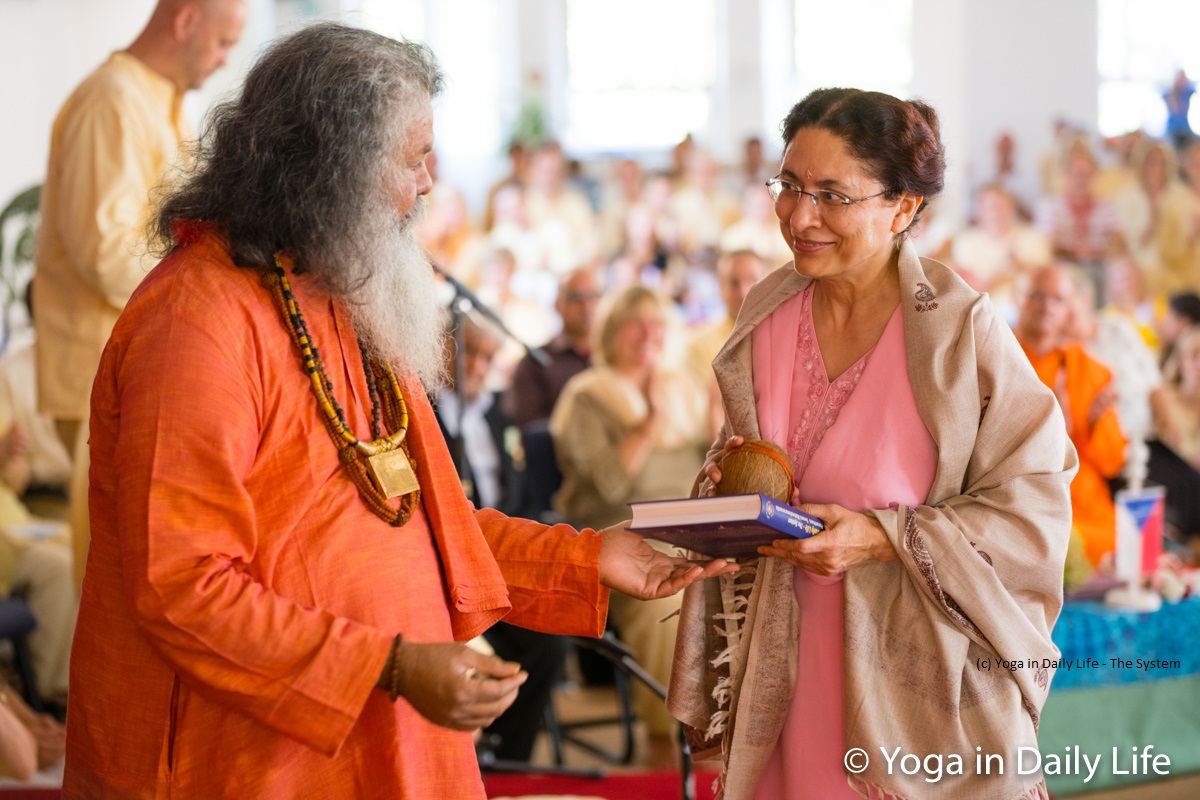 H.E. Ambassador Narinder Chauhan given a symbolic coconut and shawl by Vishwaguruji