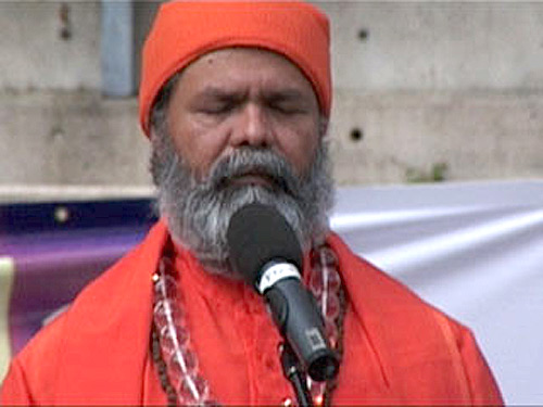 Swamiji in silent prayer on the Holi festival at Darling Harbour Swamiji in silent prayer on the Holi festival at Darling Harbour