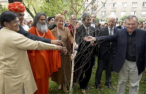 Planting a peace tree near the Summit venue Planting a peace tree near the Summit venue